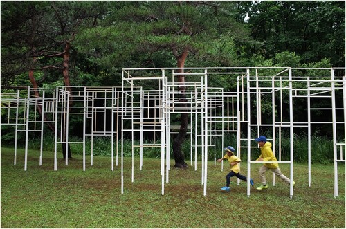 Figure 4. Photograph of 107 m3 Pavilion; its unique geometric pattern generates contrasts with the curves of Japanese pine trees. Wood construction, Benizakura Park, Sapporo. Photograph courtesy of author.