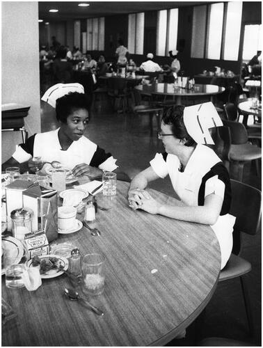 Figure 7 Bern Keating, ‘Student nurses, medical trainees and other members of the hospital staff usually eat in the Center’s cafeteria to save time and money’. ‘Southern State Medical School: Arkansas University Starts Tenth Year of Integrated Medical Training’, 1958. USIA ‘Picture Story’ Photographs, 1955–84, Record Group 306. 306-ST-468-58-4200.