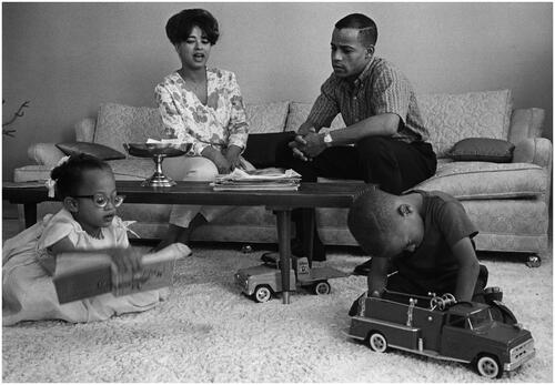 Figure 9 Don Cravens, ‘In the living room of his home at Edwards Air Force Base, California, Edward Dwight spends a quiet evening with his family. From left to right, daughter, Tina, seven years old; his wife, Sue; Captain Dwight; and son, Eddie, five, who wants to grow up to be a pilot’. ‘First Negro Astronaut Candidate’, 1963. USIA ‘Picture Story’ Photographs, 1955–84, Record Group 306. 306-ST-797-63-2940.