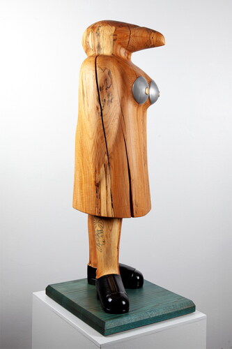 Figure 1. Alpha Female, 41” tall, spalted pear, oak, enamel, colored pencil, 2020. Photo credit: Brian Wilson.