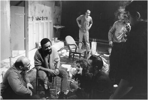Figure 11 Unknown photographer, ‘LeRoi Jones, important new talent in the American Theater, shares a lunch break with the producing staff on the stage of this play, The Toilet. His writing is often shocking, brutal, nightmarish and obscene’, 1964. ‘Other “Firsts” in New York Theater World’, Photo Bulletin, 1964–73, Box 1, Record Group 306. 306-N-65-387.