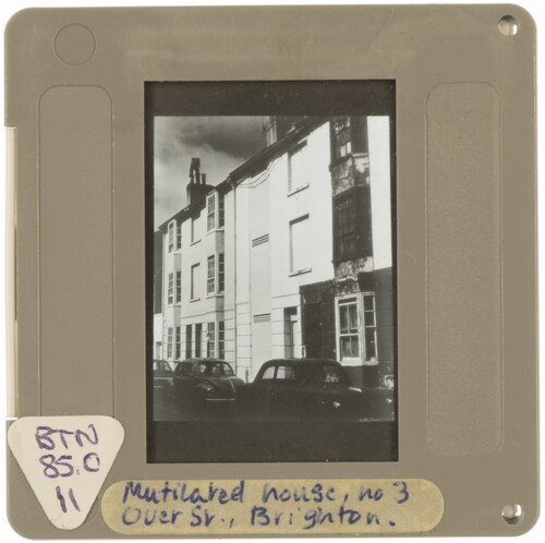 Figure 11. ‘Mutilated house, No. 3 Over St, Brighton’, undated 35mm slide, photographer unknown, former University of Brighton slide library, collection of Annebella Pollen. Photograph by Rachel Maloney, 2021.