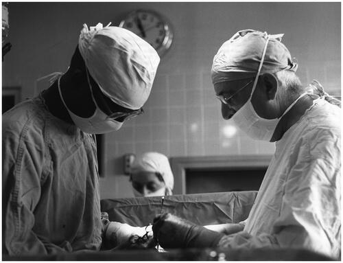 Figure 5 Unknown photographer, ‘Dr Welch (left), with the assistance of another surgeon, delivers a child by Caesarean section’. ‘A Doctor Makes His Rounds’, 1958. USIA ‘Picture Story’ Photographs, 1955–84, Record Group 306. 306-ST-460-58-24397.