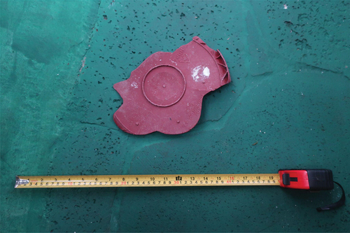 Figure 1. Bucket bottom found in Galapagos with a stamp for plastic type 2 - high density polyethylene (HDPE). Picture by the author.
