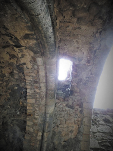 Figure 24. Castle rising: machicolation within the arch above entrance staircase.