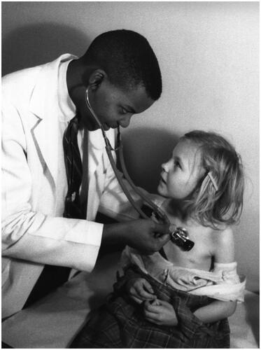 Figure 8 Bern Keating, ‘A senior student specializing in paediatrics examines a small patient in the clinic’. ‘Southern State Medical School: Arkansas University Starts Tenth Year of Integrated Medical Training’, 1958. USIA ‘Picture Story’ Photographs, 1955–84, Record Group 306. 306-ST-468-58-4225.