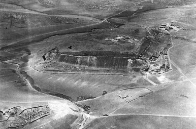 Fig. 1: Aerial view of Tel Lachish from the north, photographed on July 18, 1934 (Ussishkin Citation2004b: 24 Fig. 2.3); note the excavated area along the Outer Revetment Wall on the northern and western slopes of the mound