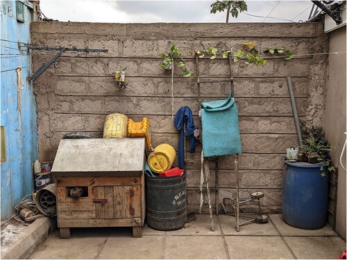 Figure 7. Backyard with dog and jerry cans in Eastleigh (2022), picture taken by the author.