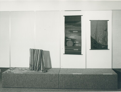 Fig 5 Installation view of Works in Thread: Works by Israeli Artists and Industrial Products at the Palevsky Pavilion, Design & Architecture Department, The Israel Museum, Jerusalem, 1975. Front left: shawl, Ziva Amir, Red Sun, Scroll with Peacock Feathers. Photograph: Reuven Milon.