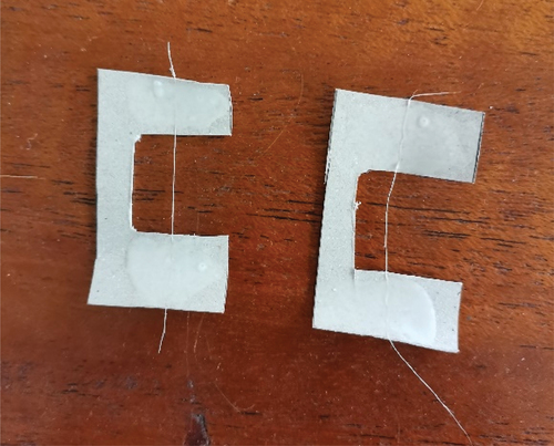 Figure 2. Sample fibre strand set in cardboard for testing.