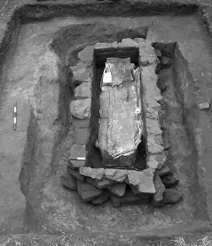Figure 3. The cist with lead coffin-lining in situ and the cist construction-cut excavated.
